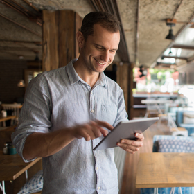 Young entrepreneur working in his restaurant